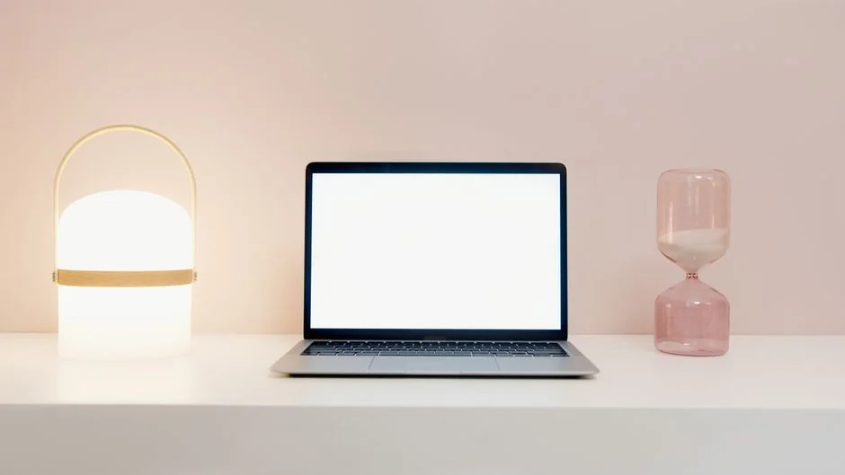 A modern computer screen displaying web design work, showcasing creative visuals in a workspace.
